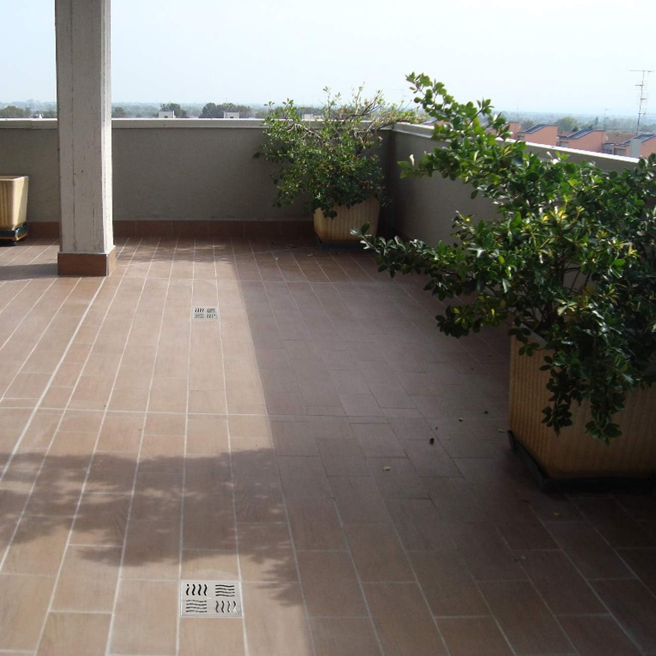 Chiusino sifonato telescopico con scarico laterale e griglia in acciaio inox