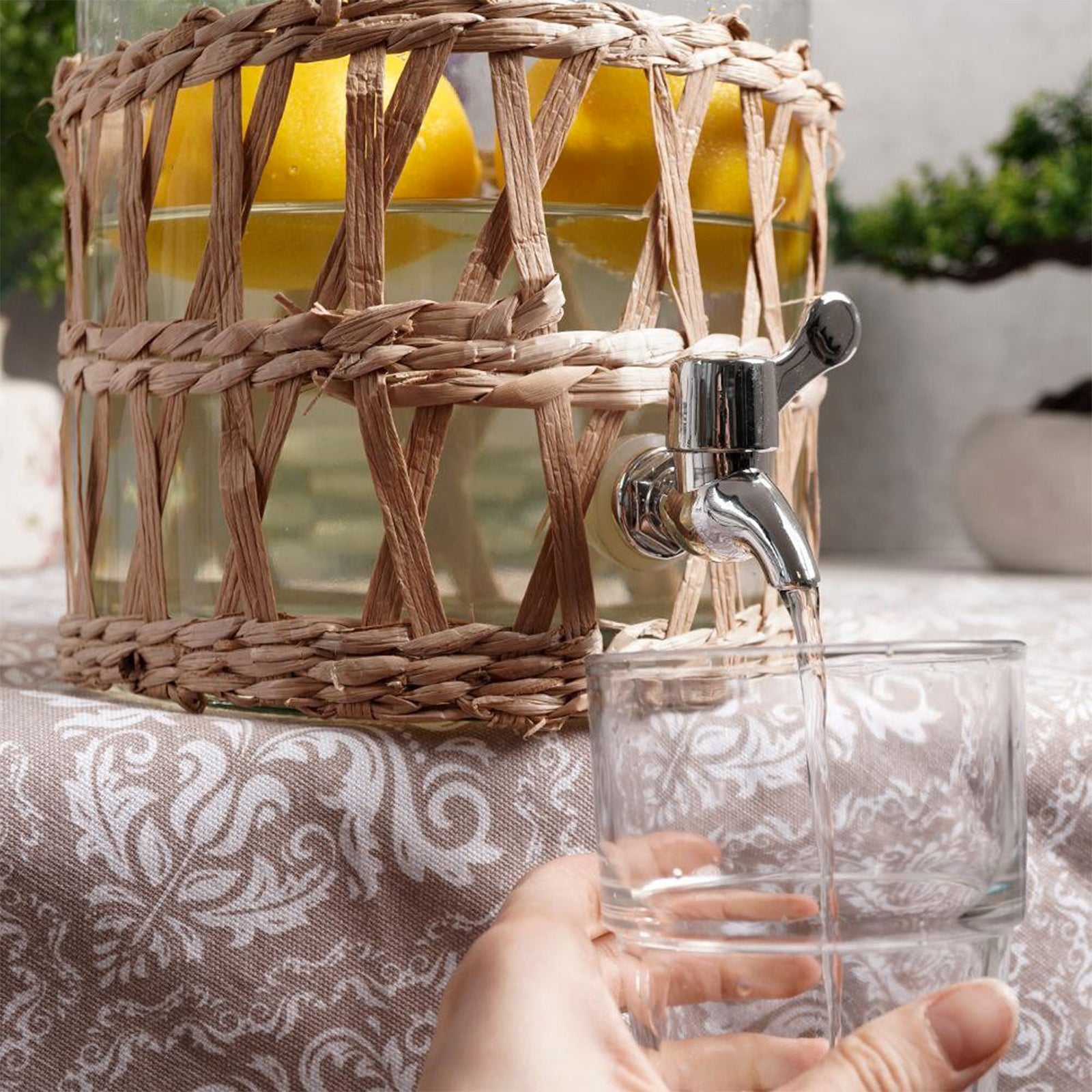 Caraffa in vetro porta bevande con rubinetto e rivestimento in Rattan 5,5 lt